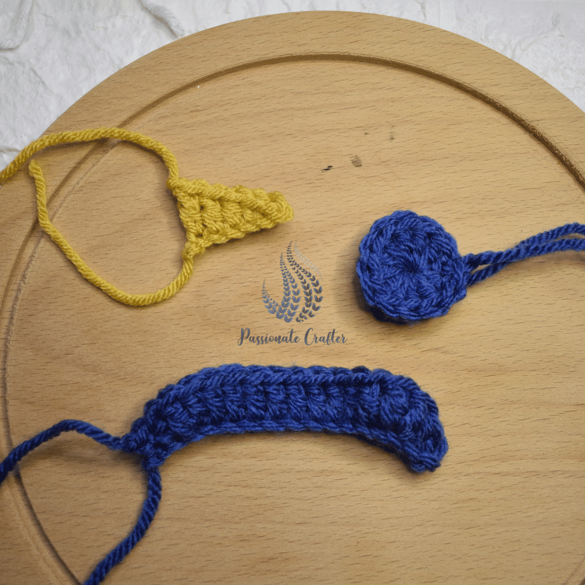 crochet nose, hat's brim and pom pom for a snowman ornament