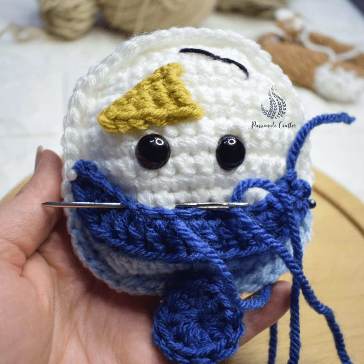 how to sew a hat's brim and pompom to a snowman ornament