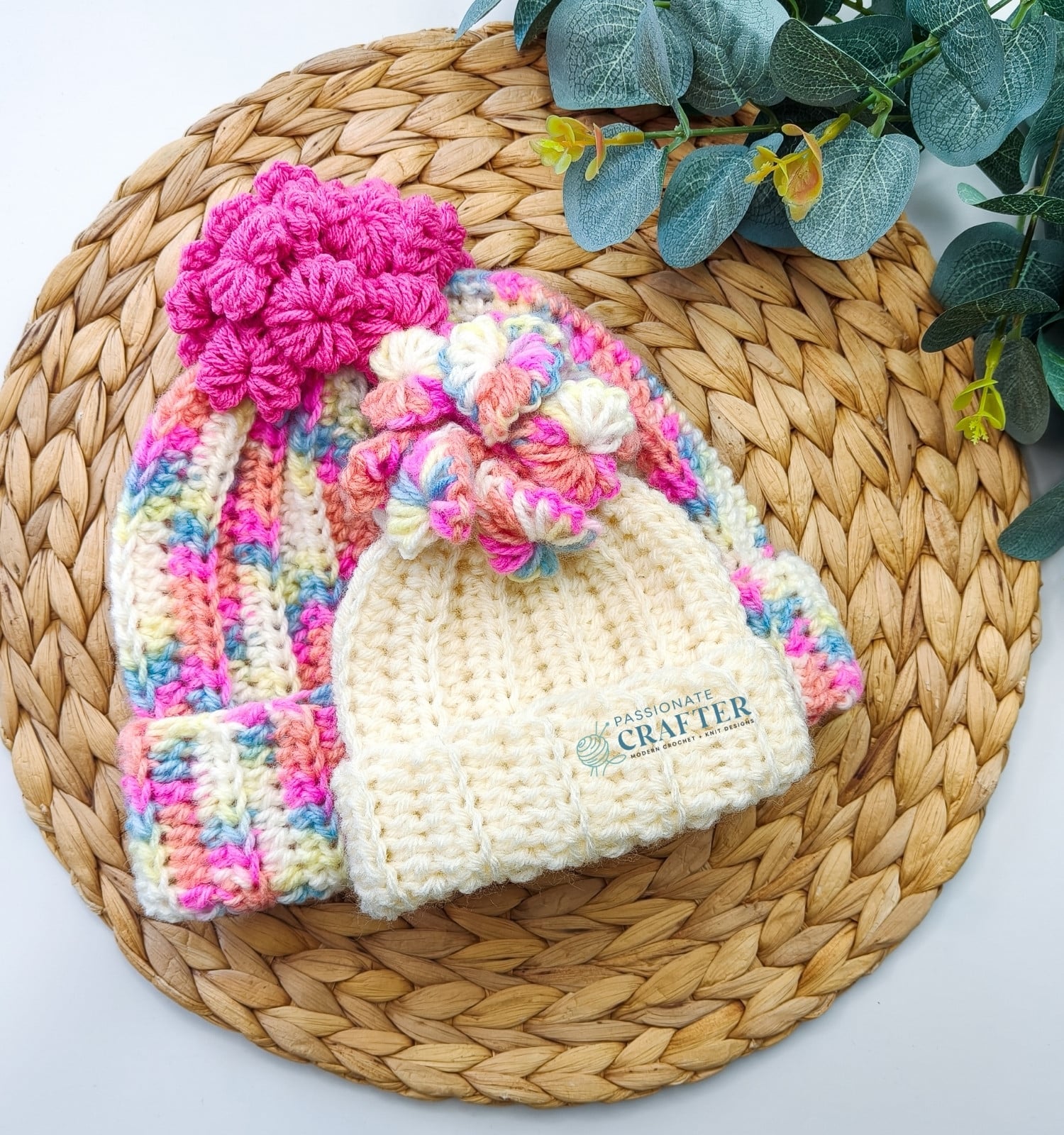 Easy Crochet Hat with hearts on top as a pom pom in pink and white colors