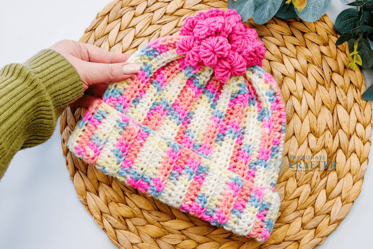 Easy Crochet Valentine hat with mini heart pom poms in white pink and blue